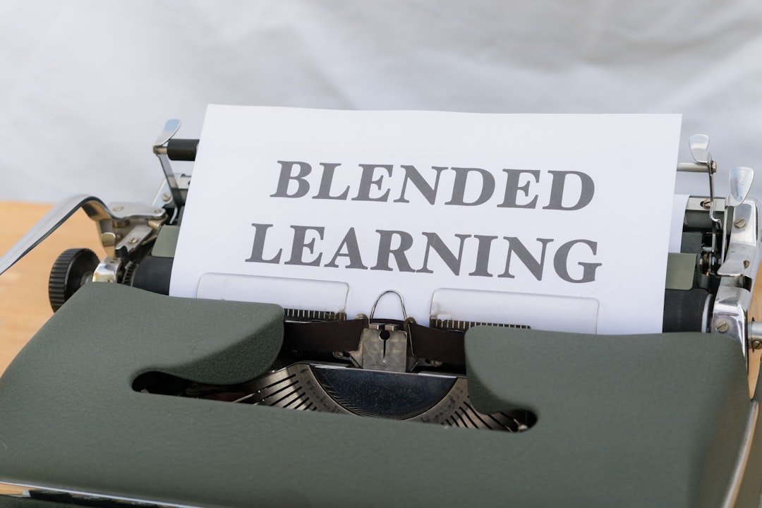 a typewriter with a sign that reads blended learning