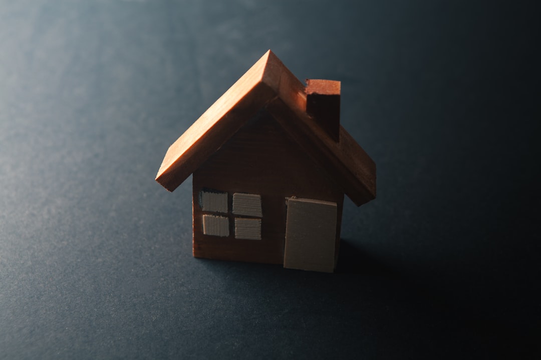 A small wooden house with windows and a door.