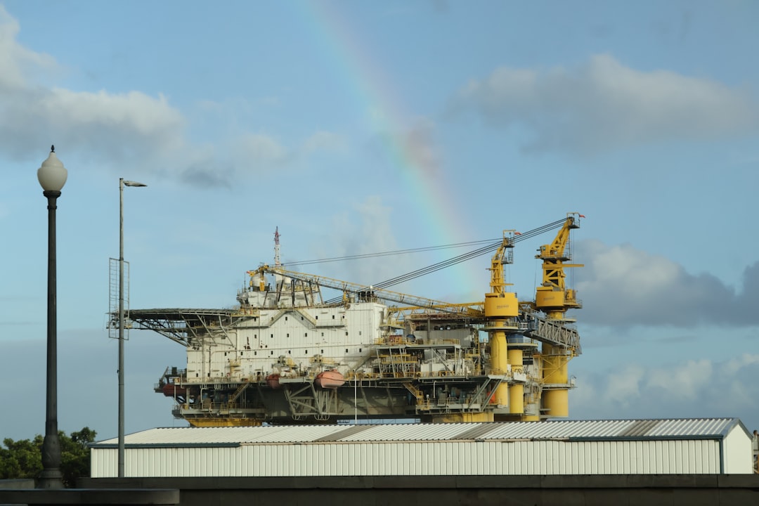 Offshore platform with rainbow in the sky.